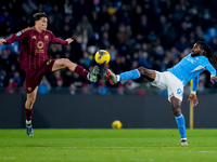 Niccolo' Pisilli of AS Roma and Andre-Frank Zambo Anguissa of SSC Napoli compete for the ball during the serie Serie A Enilive match between...