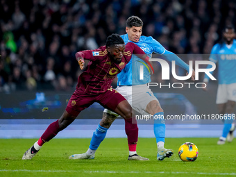 Mathias Olivera of SSC Napoli and Manu Kone' of AS Roma compete for the ball during the serie Serie A Enilive match between SSC Napoli and A...