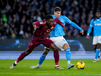 Mathias Olivera of SSC Napoli and Manu Kone' of AS Roma compete for the ball during the serie Serie A Enilive match between SSC Napoli and A...