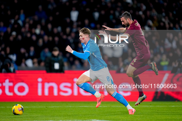 Scott McTominay of SSC Napoli and Bryan Cristante of AS Roma compete for the ball during the serie Serie A Enilive match between SSC Napoli...