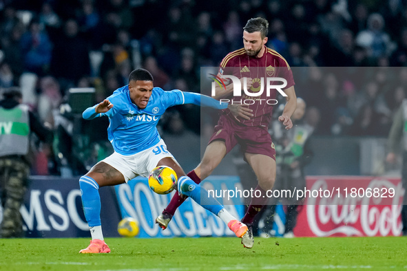 Gianluca Mancini of AS Roma and Michael Folorunsho of SSC Napoli compete for the ball during the serie Serie A Enilive match between SSC Nap...