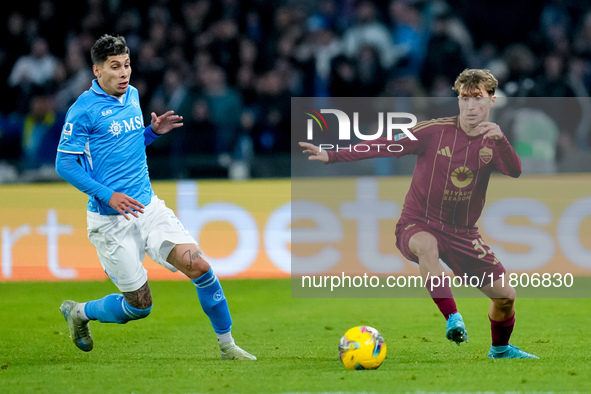 Mathias Olivera of SSC Napoli and Tommaso Baldanzi of AS Roma compete for the ball during the serie Serie A Enilive match between SSC Napoli...