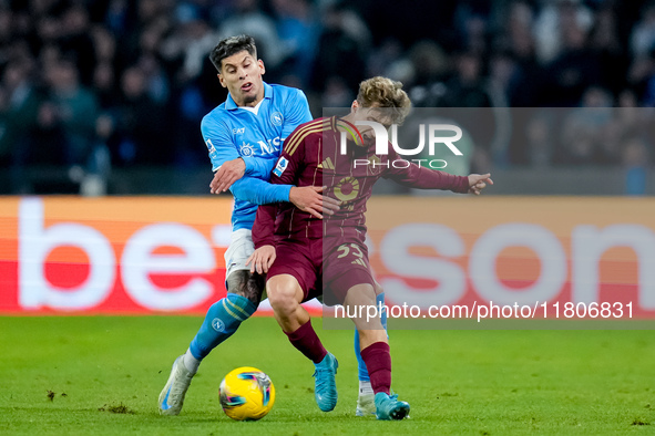 Mathias Olivera of SSC Napoli and Tommaso Baldanzi of AS Roma compete for the ball during the serie Serie A Enilive match between SSC Napoli...