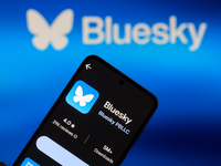 The Bluesky app logo appears on a smartphone with Bluesky visible in the background in this photo illustration in Brussels, Belgium, on Nove...