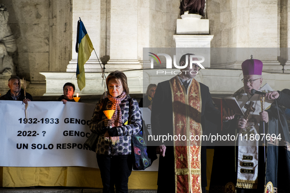 Ukrainian citizens participate in a torchlight procession in Capitol Square to commemorate the victims of the Holodomor 1932-1933, symbolizi...