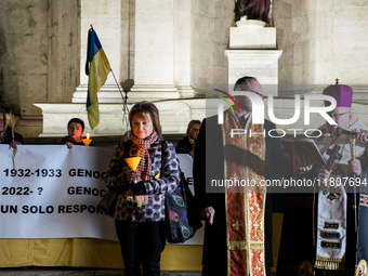 Ukrainian citizens participate in a torchlight procession in Capitol Square to commemorate the victims of the Holodomor 1932-1933, symbolizi...