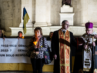 Ukrainian citizens participate in a torchlight procession in Capitol Square to commemorate the victims of the Holodomor 1932-1933, symbolizi...