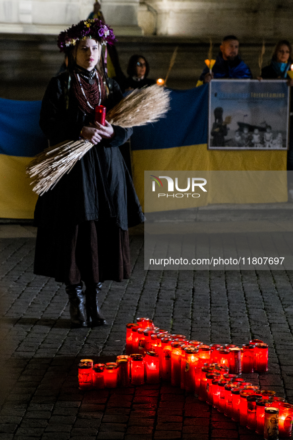 Ukrainian citizens participate in a torchlight procession in Capitol Square to commemorate the victims of the Holodomor 1932-1933, symbolizi...