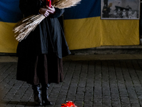 Ukrainian citizens participate in a torchlight procession in Capitol Square to commemorate the victims of the Holodomor 1932-1933, symbolizi...