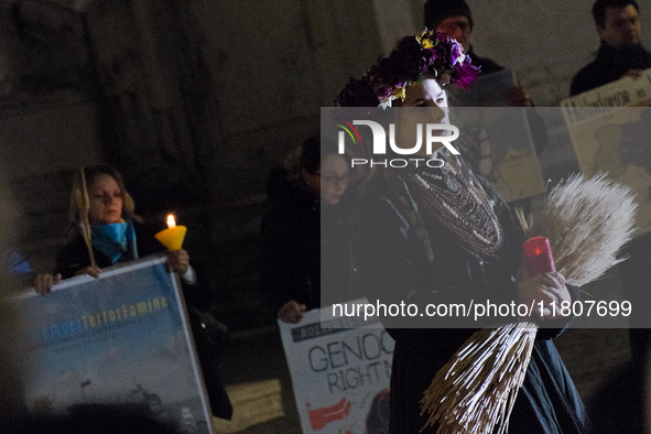 Ukrainian citizens participate in a torchlight procession in Capitol Square to commemorate the victims of the Holodomor 1932-1933, symbolizi...