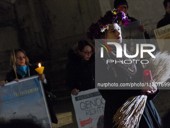 Ukrainian citizens participate in a torchlight procession in Capitol Square to commemorate the victims of the Holodomor 1932-1933, symbolizi...