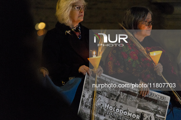 Ukrainian citizens participate in a torchlight procession in Capitol Square to commemorate the victims of the Holodomor 1932-1933, symbolizi...