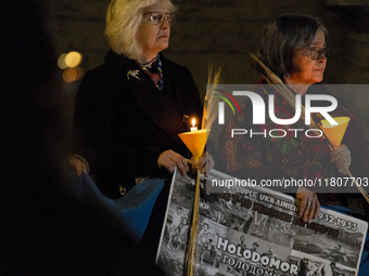 Ukrainian citizens participate in a torchlight procession in Capitol Square to commemorate the victims of the Holodomor 1932-1933, symbolizi...