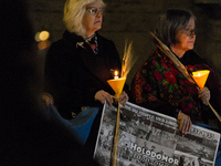 Ukrainian citizens participate in a torchlight procession in Capitol Square to commemorate the victims of the Holodomor 1932-1933, symbolizi...