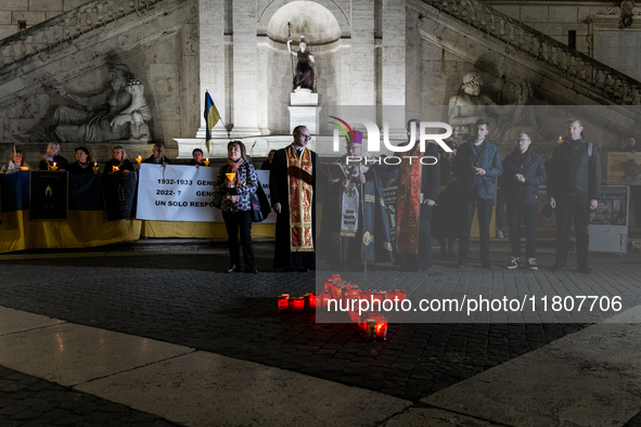 Ukrainian citizens participate in a torchlight procession in Capitol Square to commemorate the victims of the Holodomor 1932-1933, symbolizi...