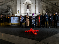 Ukrainian citizens participate in a torchlight procession in Capitol Square to commemorate the victims of the Holodomor 1932-1933, symbolizi...