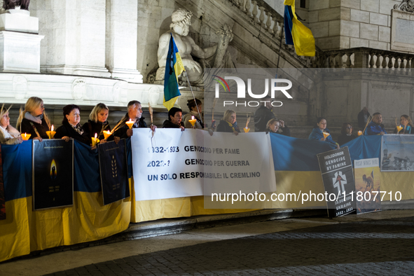 Ukrainian citizens participate in a torchlight procession in Capitol Square to commemorate the victims of the Holodomor 1932-1933, symbolizi...