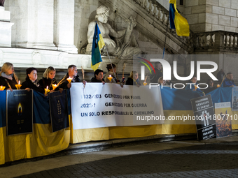 Ukrainian citizens participate in a torchlight procession in Capitol Square to commemorate the victims of the Holodomor 1932-1933, symbolizi...