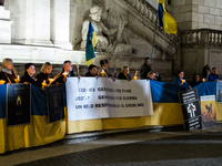 Ukrainian citizens participate in a torchlight procession in Capitol Square to commemorate the victims of the Holodomor 1932-1933, symbolizi...