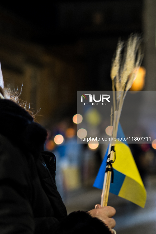 Ukrainian citizens participate in a torchlight procession in Capitol Square to commemorate the victims of the Holodomor 1932-1933, symbolizi...