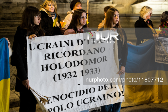 Ukrainian citizens participate in a torchlight procession in Capitol Square to commemorate the victims of the Holodomor 1932-1933, symbolizi...