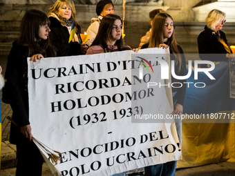 Ukrainian citizens participate in a torchlight procession in Capitol Square to commemorate the victims of the Holodomor 1932-1933, symbolizi...