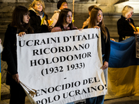 Ukrainian citizens participate in a torchlight procession in Capitol Square to commemorate the victims of the Holodomor 1932-1933, symbolizi...