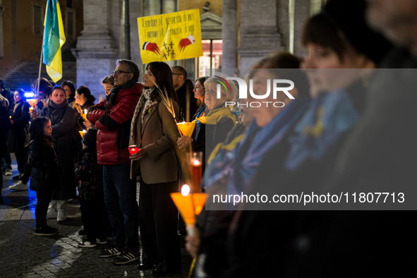 Ukrainian citizens participate in a torchlight procession in Capitol Square to commemorate the victims of the Holodomor 1932-1933, symbolizi...