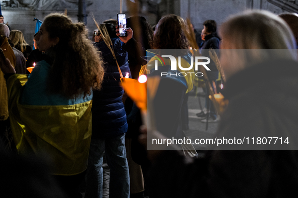 Ukrainian citizens participate in a torchlight procession in Capitol Square to commemorate the victims of the Holodomor 1932-1933, symbolizi...