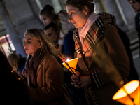 Ukrainian citizens participate in a torchlight procession in Capitol Square to commemorate the victims of the Holodomor 1932-1933, symbolizi...