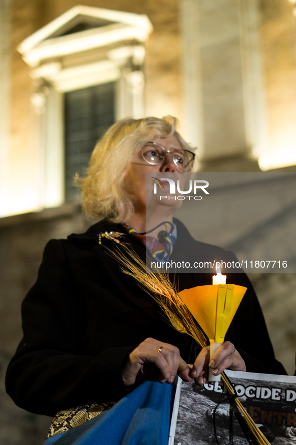 Ukrainian citizens participate in a torchlight procession in Capitol Square to commemorate the victims of the Holodomor 1932-1933, symbolizi...