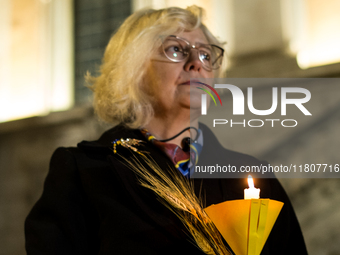 Ukrainian citizens participate in a torchlight procession in Capitol Square to commemorate the victims of the Holodomor 1932-1933, symbolizi...