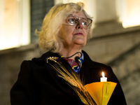 Ukrainian citizens participate in a torchlight procession in Capitol Square to commemorate the victims of the Holodomor 1932-1933, symbolizi...