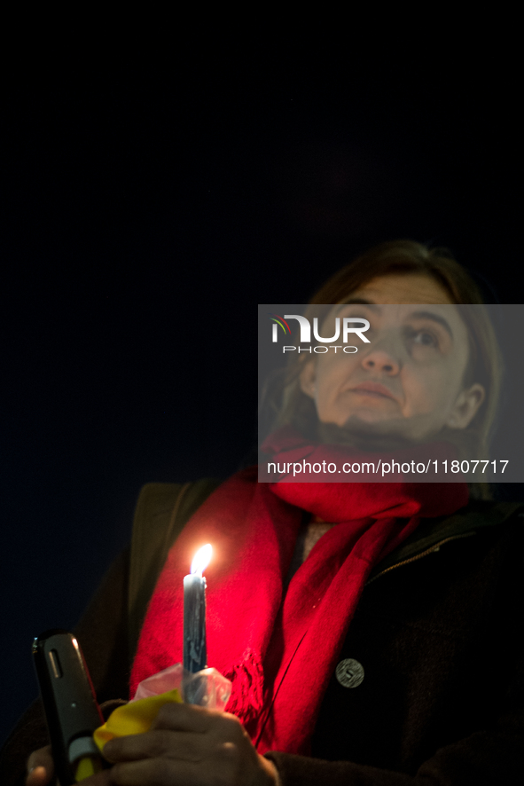 Ukrainian citizens participate in a torchlight procession in Capitol Square to commemorate the victims of the Holodomor 1932-1933, symbolizi...