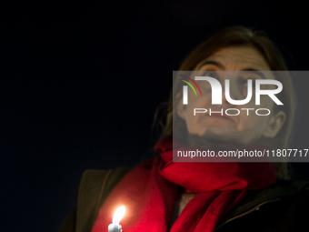 Ukrainian citizens participate in a torchlight procession in Capitol Square to commemorate the victims of the Holodomor 1932-1933, symbolizi...