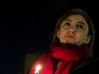 Ukrainian citizens participate in a torchlight procession in Capitol Square to commemorate the victims of the Holodomor 1932-1933, symbolizi...