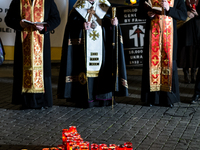 Ukrainian citizens participate in a torchlight procession in Capitol Square to commemorate the victims of the Holodomor 1932-1933, symbolizi...