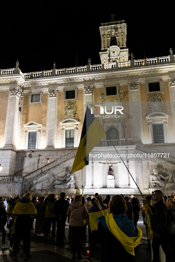 Ukrainian citizens participate in a torchlight procession in Capitol Square to commemorate the victims of the Holodomor 1932-1933, symbolizi...