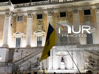 Ukrainian citizens participate in a torchlight procession in Capitol Square to commemorate the victims of the Holodomor 1932-1933, symbolizi...