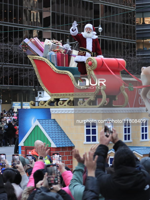 A person dressed as Santa Claus participates in the annual Santa Claus Parade in Toronto, Ontario, Canada, on November 24, 2024. Thousands o...