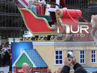 A person dressed as Santa Claus participates in the annual Santa Claus Parade in Toronto, Ontario, Canada, on November 24, 2024. Thousands o...