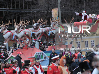 A person dressed as Santa Claus participates in the annual Santa Claus Parade in Toronto, Ontario, Canada, on November 24, 2024. Thousands o...