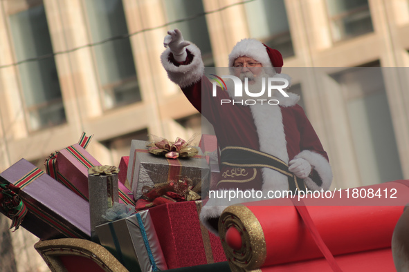 A person dressed as Santa Claus participates in the annual Santa Claus Parade in Toronto, Ontario, Canada, on November 24, 2024. Thousands o...