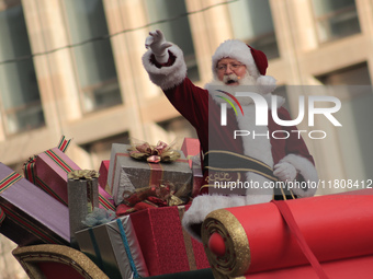 A person dressed as Santa Claus participates in the annual Santa Claus Parade in Toronto, Ontario, Canada, on November 24, 2024. Thousands o...