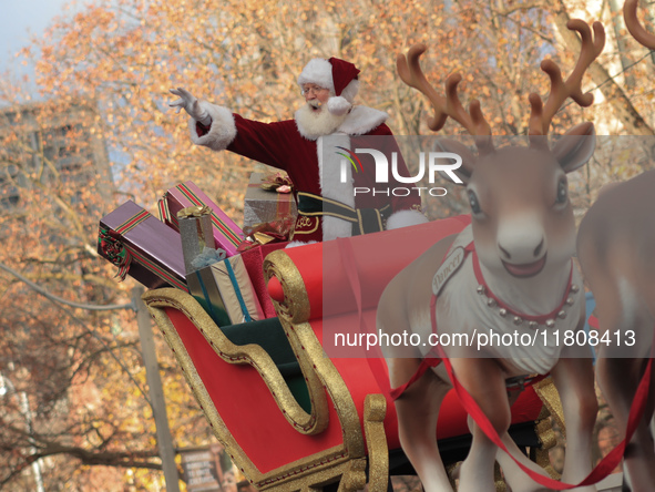 A person dressed as Santa Claus participates in the annual Santa Claus Parade in Toronto, Ontario, Canada, on November 24, 2024. Thousands o...