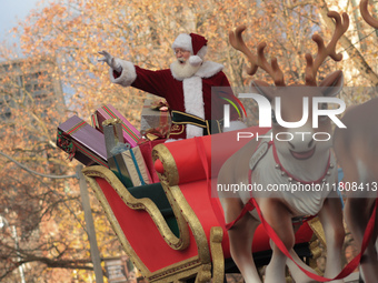 A person dressed as Santa Claus participates in the annual Santa Claus Parade in Toronto, Ontario, Canada, on November 24, 2024. Thousands o...