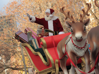 A person dressed as Santa Claus participates in the annual Santa Claus Parade in Toronto, Ontario, Canada, on November 24, 2024. Thousands o...