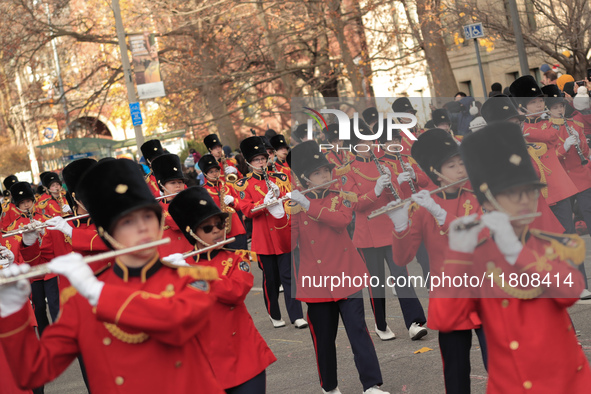 Participants take part in the annual Santa Claus Parade in Toronto, Ontario, Canada, on November 24, 2024. Thousands of people line the stre...