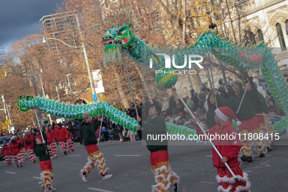 Participants take part in the annual Santa Claus Parade in Toronto, Ontario, Canada, on November 24, 2024. Thousands of people line the stre...