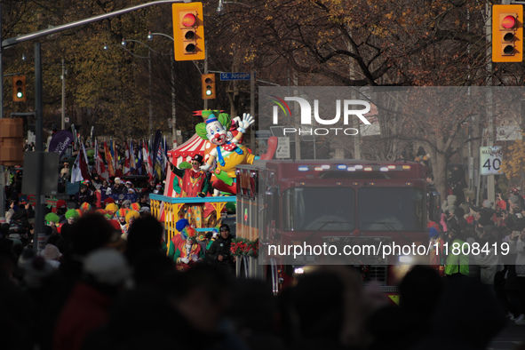 Participants take part in the annual Santa Claus Parade in Toronto, Ontario, Canada, on November 24, 2024. Thousands of people line the stre...